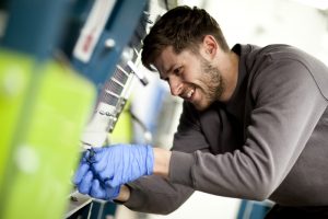 This is a corporate shot of a suited Greenbank employee working in an work setting in Middlesbrough, Teeside.