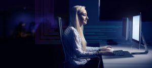 This is an advertising shot of a student being photographed in a office style photograph featuring electric graphics for the company Baltic Training which is based around the Northeast of England.