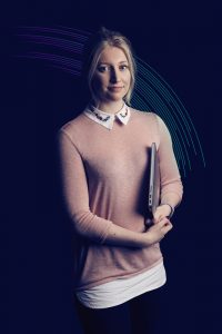 This is an advertising shot of a tutor being photographed in a studio style photograph featuring electric graphics for the company Baltic Training which is based around the Northeast of England.
