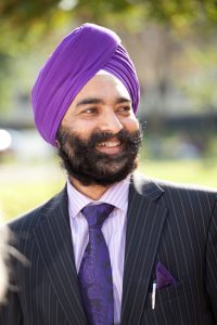 Professional commercial shot showing a man smiling and looking to the right. Shot by professional northeast commercial photographer Cal Carey.