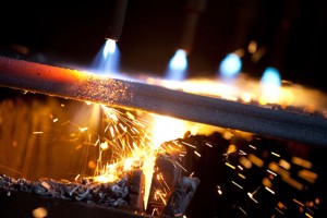 Professional industrial shot showing a close-up of some welding with sparks flying. Shot by professional northeast industrial photographer Cal Carey.