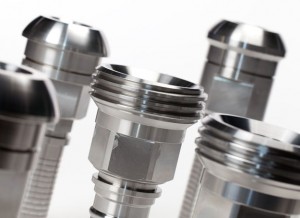 Professional industrial product shot showing a close-up of metal bolts and screws on a white background. Shot by professional northeast industrial product photographer Cal Carey.