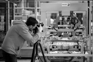 Black and white behind the scenes shot showing Cal Carey Photographer shooting industrial equipment at Ebac.