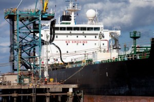 Professional industrial shot of an oil tanker delivering diesel to north-tees fuel terminal. Shot by professional northeast industrial photographer Cal Carey.