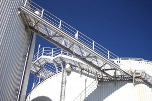 Professional industrial shot showing a bridge in-between cylinders at a waste to energy facility. Shot by professional northeast industrial photographer Cal Carey.
