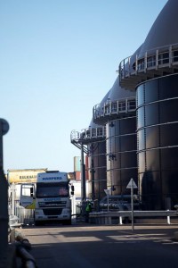 Professional industrial shot of a truck delivering at a waste to energy facility. It's a portrait shot with the truck in the left third. Shot by professional northeast industrial photographer Cal Carey.