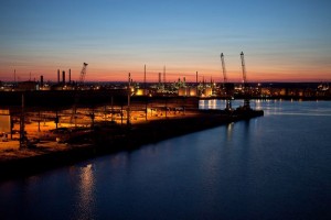 Professional industrial shot of a dock at sunfall with a warm sky on the horizon. Shot by professional northeast photographer Cal Carey.