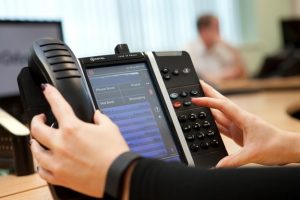 Professional commercial photography shot showing a hand on one of odysseys telecommunication systems. Shot by professional northeast commercial photographer Cal Carey.