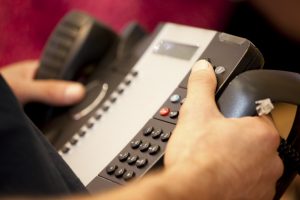 Professional commercial photography shot showing a hand on one of odysseys telecommunication systems. Shot by professional northeast commercial photographer Cal Carey.
