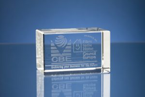 Professional product photography shot showing a glass 3D rectangle with the logo of CBE inside. Shot by professional northeast product photographer Cal Carey.