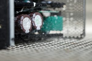 Professional commercial photography shot showing an environmental testing process against circuitry equipment. Shot by professional northeast commercial photographer Cal Carey.