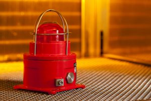 Professional commercial photography shot showing some security equipment, an alarm, going through environmental testing of extreme heat temperature. Shot by professional northeast commercial photographer Cal Carey.