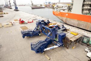 Professional commercial photography shot showing a birdseye view of the pile restraint arms on teesport with the pacific orca in view behind it. Shot by professional northeast commercial photographer Cal Carey.