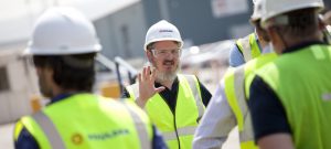 Professional commercial photography shot showing a member of the Houlder team giving a talk to other members of Houlder, partners, clients etc about the new pile restraint arms at Teesport. Shot by professional northeast commercial photographer Cal Carey.