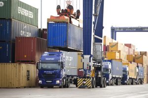 Professional commercial photography shot showing PD Ports new lorry on the docks, getting a container placed onto it. Shot by professional northeast commercial photographer Cal Carey.
