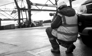 Black and white behind the scenes image from an industrial transport shoot at Teesport taking photographs of the new PD Ports lorries.