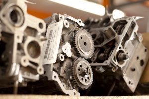 Professional industrial photography shot showing a close up of motor parts on a shelf with one in focus. Shot by professional northeast industrial photographer Cal Carey.