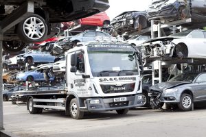 Professional industrial photography shot showing the company recovery truck on an angle between the two rows of cars. Shot by professional northeast industrial photographer Cal Carey.