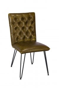 A photograph of a living room chair made of steel and leather, furniture photography by Cal Carey Photography